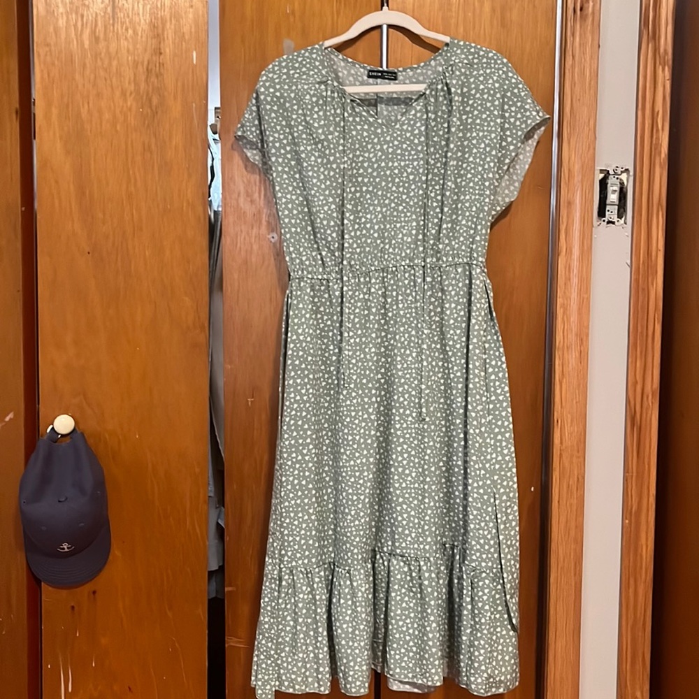 Midi dress with cute white heart print and self tie belt.